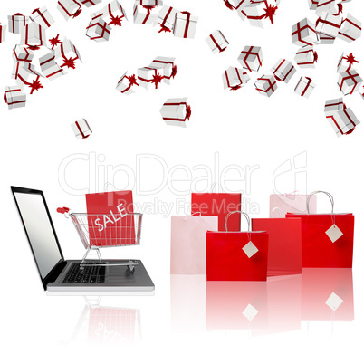 Composite image of trolley on laptop with sale bag