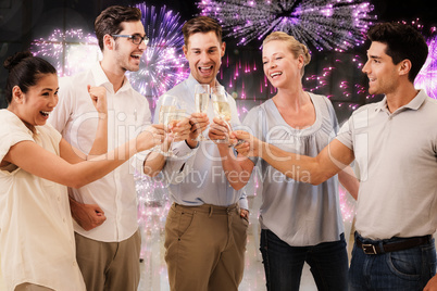 Composite image of casual business team celebrating with champag