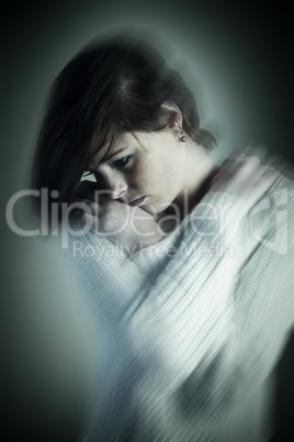 Composite image of sad pretty brunette thinking with arms crosse