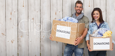 Composite image of portrait of a happy young couple with clothes