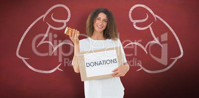 Composite image of happy volunteer holding a box of donations an