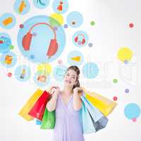 Composite image of thoughtful brunette holding shopping bags