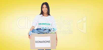 Composite image of happy woman carrying donation box