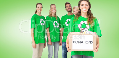 Composite image of people in recycling symbol tshirts with donat