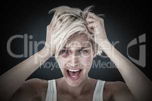 Composite image of stressed woman screaming and holding her head