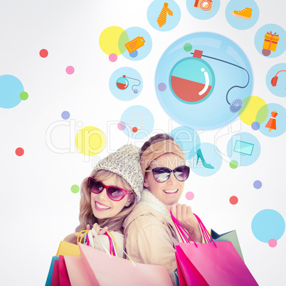 Composite image of beautiful women holding shopping bags looking