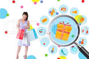 Composite image of stylish brunette in purpul dress opening shop