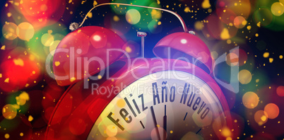 Composite image of feliz ano nuevo in red alarm clock