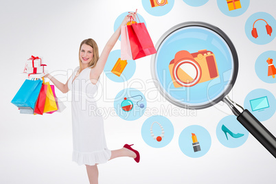 Composite image of elegant blonde with shopping bags and gifts