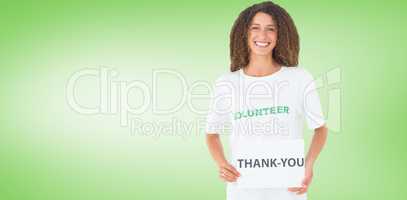Composite image of smiling volunteer showing a thank you poster