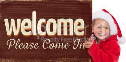 Composite image of festive little girl showing poster