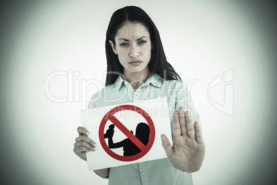 Composite image of woman showing card and saying stop