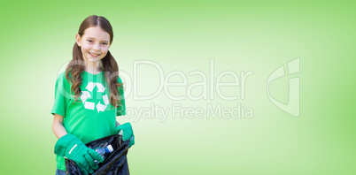 Composite image of happy little girl collecting rubbish