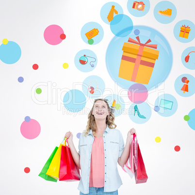 Composite image of woman holding some shopping bags