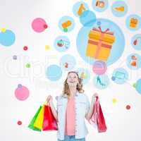 Composite image of woman holding some shopping bags