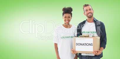 Composite image of smiling young couple with clothes donation