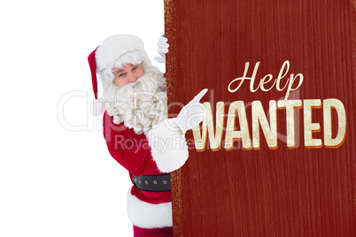 Composite image of smiling santa claus pointing poster