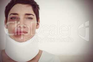 Close up of a sad Woman with a surgical collar