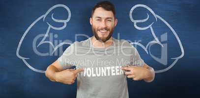 Composite image of man showing volunteer text on tshirt