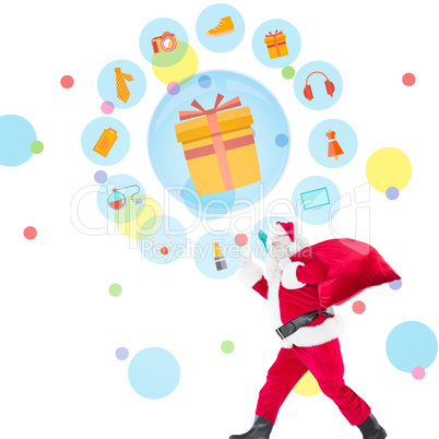 Composite image of positive santa with a sack and thumbs up