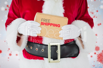 Composite image of mid section of santa claus holding box