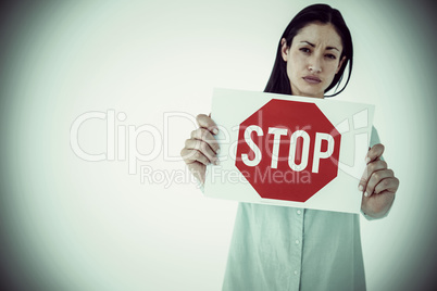 Composite image of sad woman showing sign