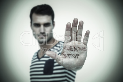 Composite image of portrait of serious man making stop sign