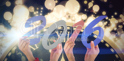 Composite image of hands showing 2016 Composite image of hands showing 2016