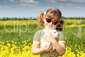 little girl with bunny pet