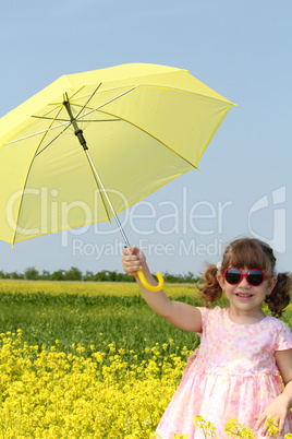 happy little girl with yellow umbrella