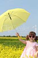 happy little girl with yellow umbrella