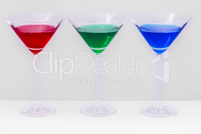 glasses with colored liquids