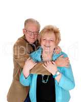 Older couple hugging .