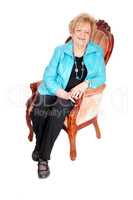 Lovely older woman in armchair.