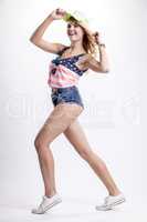 Blonde woman posing in American flag shirt