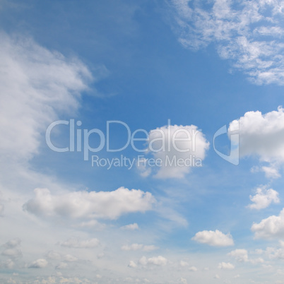 light cumulus clouds in the blue sky