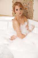 Woman in bath relaxing. Closeup of young woman in bathtub bathin