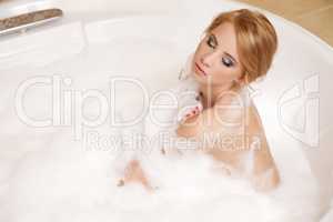 Woman in bath relaxing. Closeup of young woman in bathtub bathin