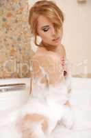 Woman in bath relaxing. Closeup of young woman in bathtub bathin