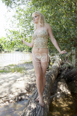 Fashion portrait of young sensual woman in garden