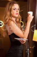 Beautiful young woman with a cup