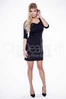 Young slim sexy woman in black dress isolated on white backgroun