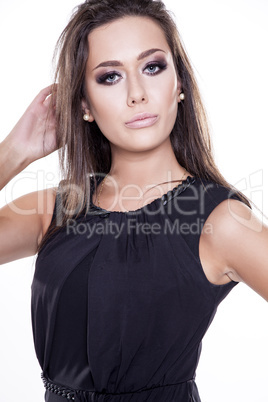 Young slim sexy woman in black dress isolated on white backgroun