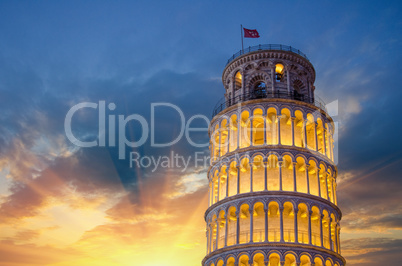 Tower of Pisa in Miracles Square, Illuminated at Night with sunset, Italy