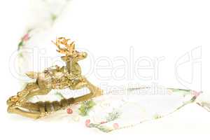 Decorative Christmas Reindeer Ornament and Ribbon on White