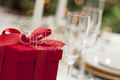 Christmas Gift with Place Setting at Table