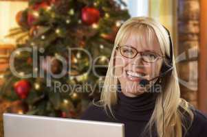 Woman with Phone Headset In Front of Christmas Tree, Computer