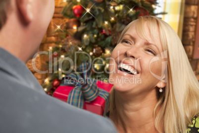 Girl Exchanging Gift At Christmas Party