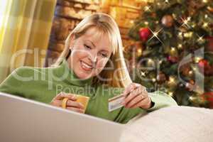 Woman with Credit Card In Front of Laptop, Christmas Tree