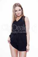 Young slim sexy woman in black dress isolated on white backgroun